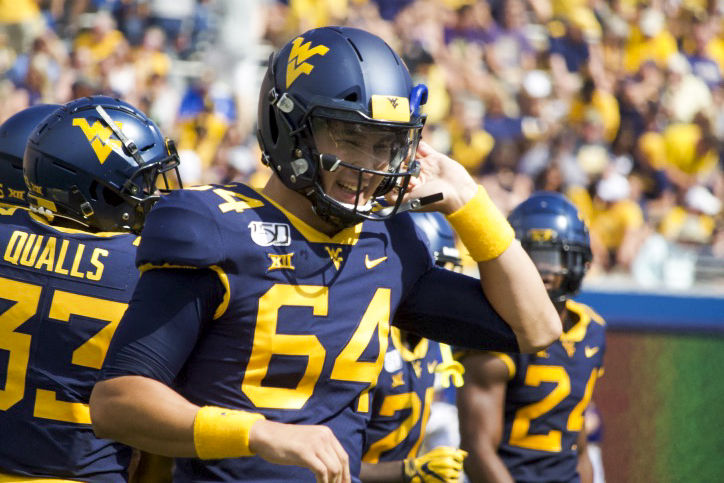 West Virginia long snapper Rex Sunahara returns to the sideline following a successful play against James Madison at Milan Puskar Stadium on Aug. 31.
